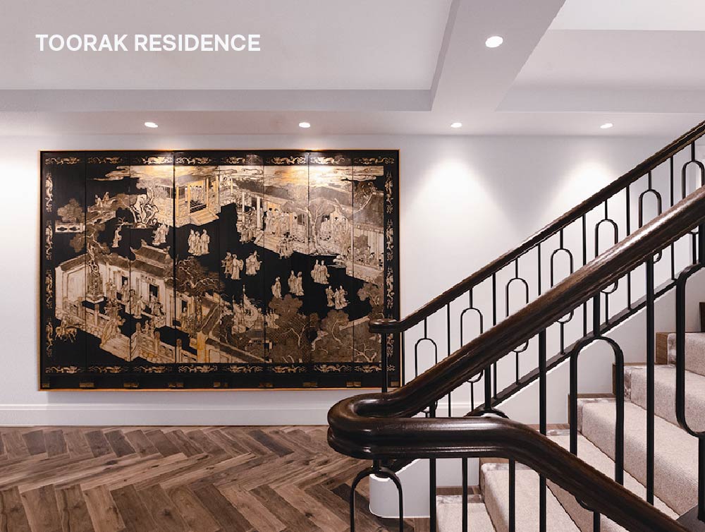 the entrance at a residential house displays an antique privacy screen from china